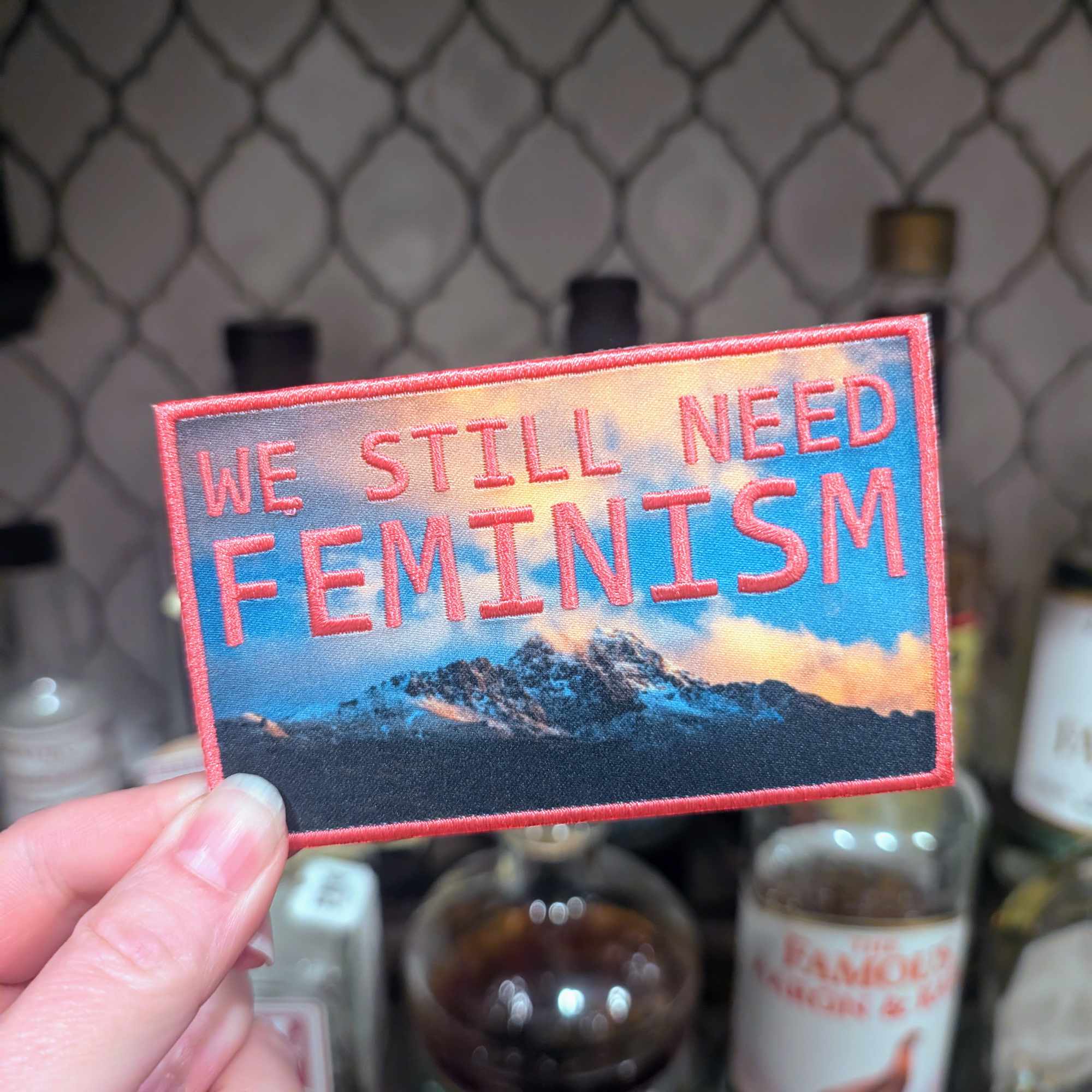 We Still Need Feminism iron-on patch (sunrise pink version)